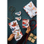 Gift-wrapping set with bird-themed paper and ribbons on a dark surface